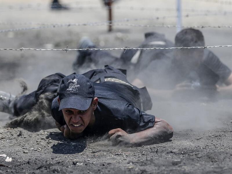 Palestinian military cadets take part in a training session organised by Hamas' military wing, the Ezzedin al-Qassam Brigades, in Gaza City on July 20, 2019.  MAHMUD HAMS / AFP