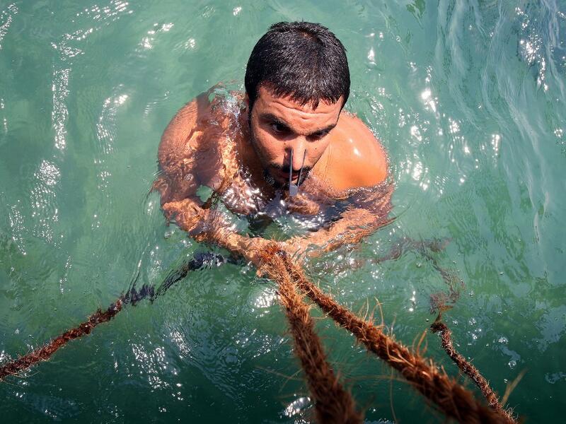 Pearl-diving trips are held annually under the patronage of the Kuwaiti emir in order to keep alive traditions that accompanied the once important national trade of pearl diving, prior to the discovery of oil. Yasser Al-Zayyat / AFP