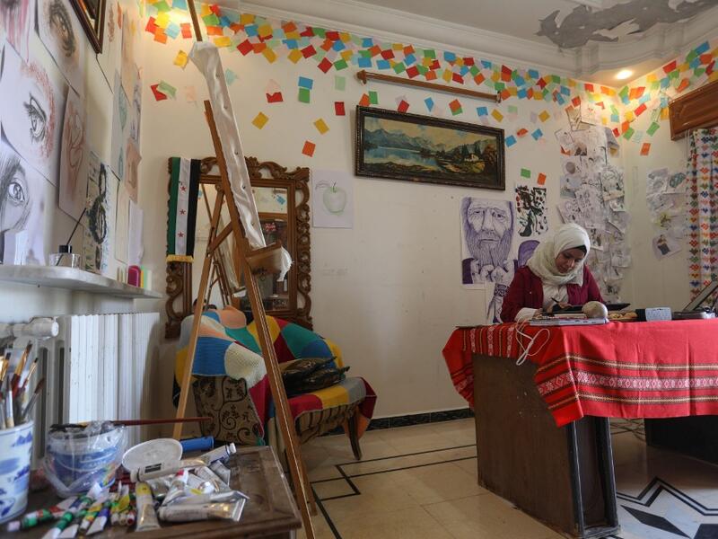 Through her cartoons, Ali has boldly challenged traditions to comment on life in the anti-regime bastion, and to condemn seeming international indifference to civilian deaths. Omar HAJ KADOUR / AFP