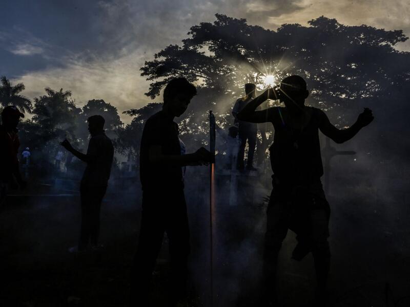 Catholic faithful light fireworks, during the opening of the ten-day celebration of the Santo Domingo de Guzman festival in Managua, on August 1, 2019.  INTI OCON / AFP