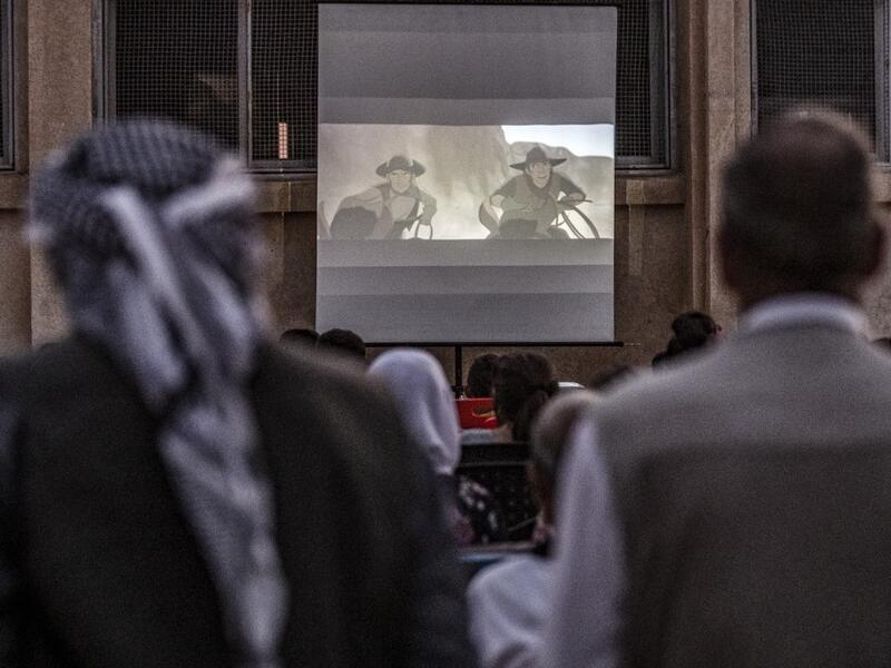 Hinde is screening films in remote villages using just a laptop, projector and a canvas screen. With some films dubbed into Kurdish and others subtitled, he and a team of volunteers want to spread their love of cinema across Rojava, the Kurdish name of the semi-autonomous northeast of war-torn Syria. DELIL SOULEIMAN / AFP