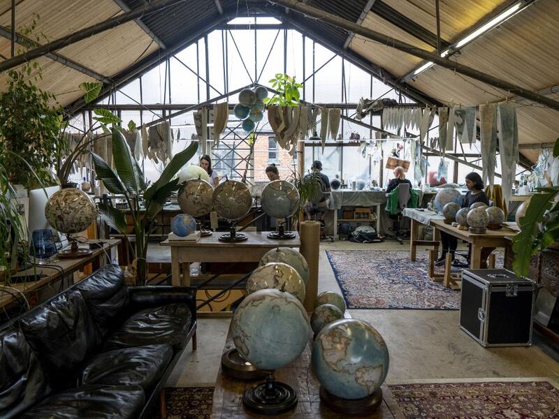 Artisan globemakers are pictured at work at the Bellerby and Co Globemakers' workshop and headquarters in Stoke Newington in north London, on July 19, 2019. Niklas HALLE'N / AFP