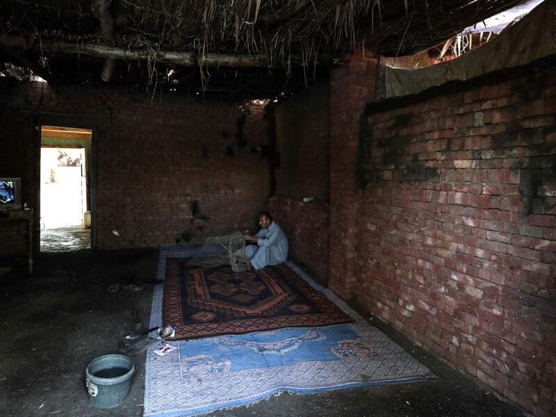 An Egyptian Fisherman handles a net before fishing in the waters of the Pharaonic Sea in the village of Kafr Fisha, province of Monufia, on August 13, 2019. Mohamed el-Shahed / AFP
