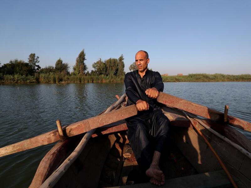An Egyptian Fisherman sails in the waters of the Pharaonic Sea in the village of Kafr Fisha, province of Monufia, on August 13, 2019. Mohamed el-Shahed / AFP
