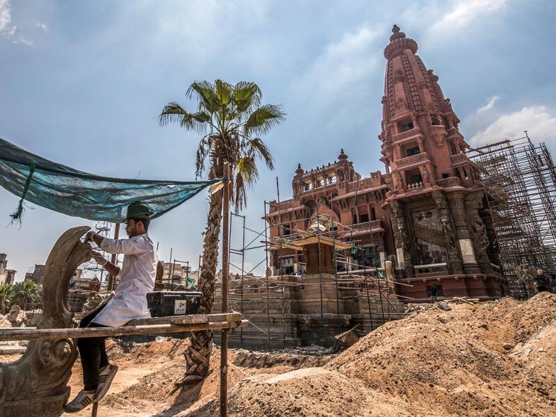 This picture taken on August 18, 2019 shows restoration works ongoing at the historic "Le Palais Hindou" (also known as the "Baron Empain Palace") built by in the early 20th century by Belgian industrialist Edouard Louis Joseph, Baron Empain, in the classical Khmer architectural style of Cambodia's Angkor Wat, in the Egyptian capital Cairo's northeastern Heliopolis district.  Khaled DESOUKI / AFP
