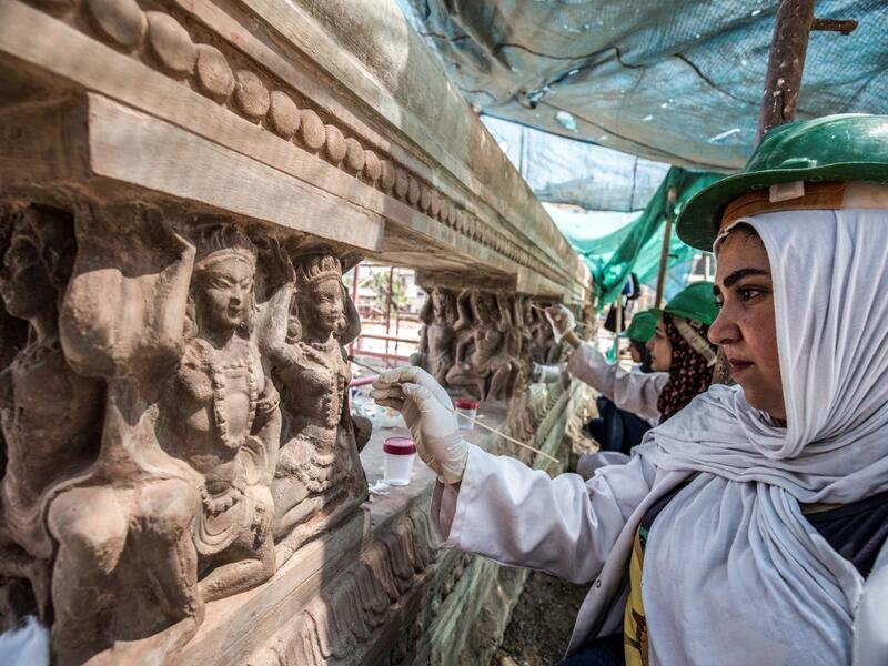 Archaeologists work on restoring relief sculptures at the historic "Le Palais Hindou" (also known as the "Baron Empain Palace") built by in the early 20th century by Belgian industrialist Edouard Louis Joseph, Baron Empain, in the classical Khmer architectural style of Cambodia's Angkor Wat, in the Egyptian capital Cairo's northeastern Heliopolis district on August 18, 2019.  Khaled DESOUKI / AFP