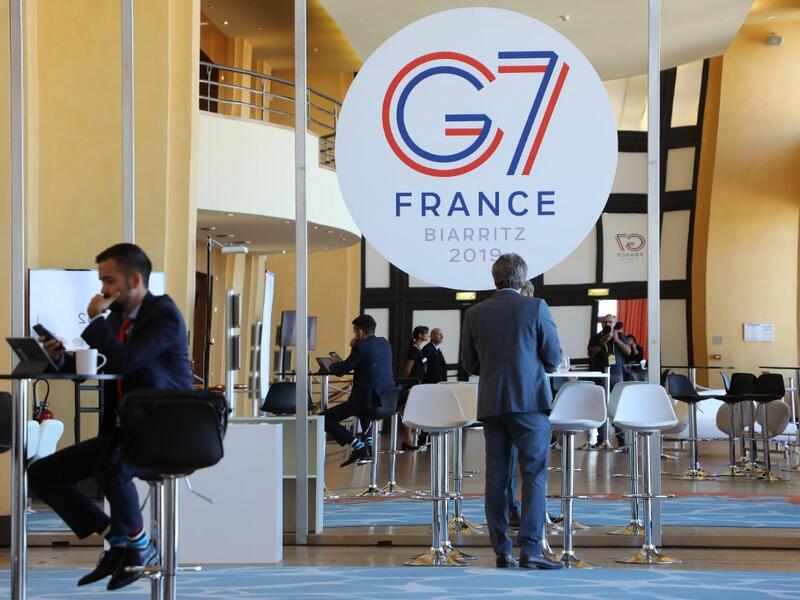 People work in the advanced press centre in the Casino of Biarritz, south-west France on August 24, 2019. ludovic MARIN / AFP