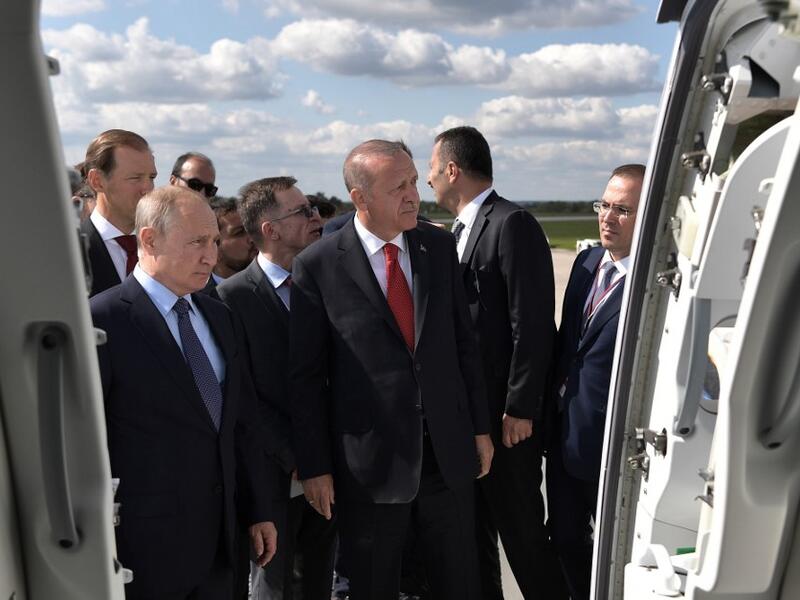 Russian President Vladimir Putin (L) shakes hands with his Turkish counterpart Recep Tayyip Erdogan visit the MAKS-2019 International Aviation and Space Salon opening day in Zhukovsky outside Moscow on August 27, 2019.  Alexey NIKOLSKY / SPUTNIK / AFP