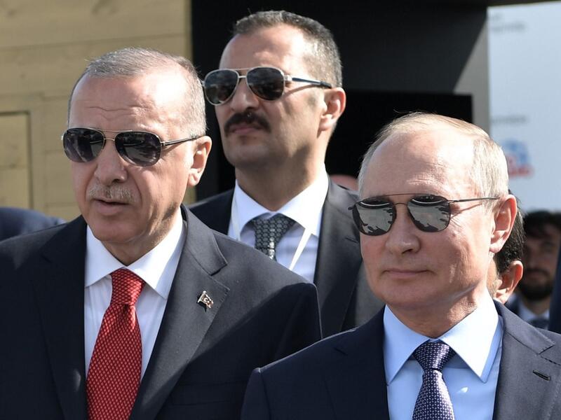 Russian President Vladimir Putin (R) and his Turkish counterpart Recep Tayyip Erdogan visit the MAKS-2019 International Aviation and Space Salon opening day in Zhukovsky outside of Moscow on August 27, 2019. (Alexey NIKOLSKY / SPUTNIK / AFP)