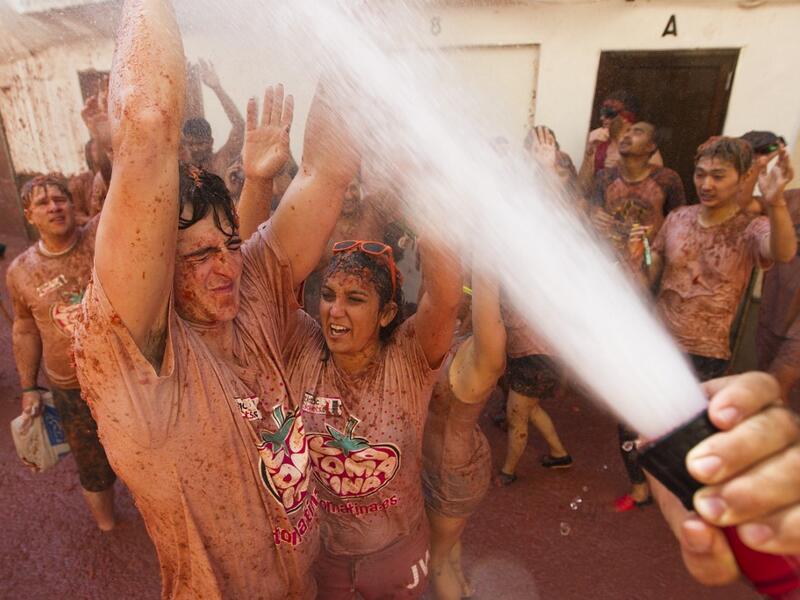 The iconic fiesta, which is billed at "the world's biggest food fight" has become a major draw for foreigners, in particular from Britain, Japan and the United States. JAIME REINA / AFP