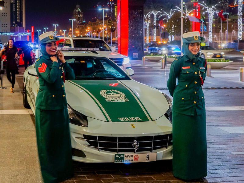 Dubai women police at the luxurious Ferrari near Dubai Mall. (Shutterstock/ File Photo)