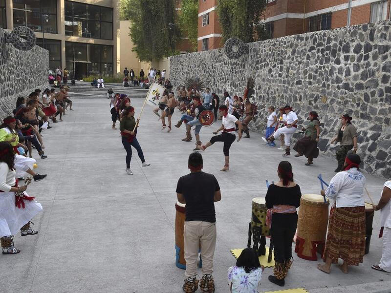 Dancers and players perform ahead of a pre-Columbian ballgame called "Ulama" -in Nahuatl indigenous language- which rule is to hit a "Ulamaloni" (solid rubber ball) with the hip or shoulder, at the FARO Poniente cultural center in Mexico City on August 21, 2019. ROCIO VAZQUEZ / AFP