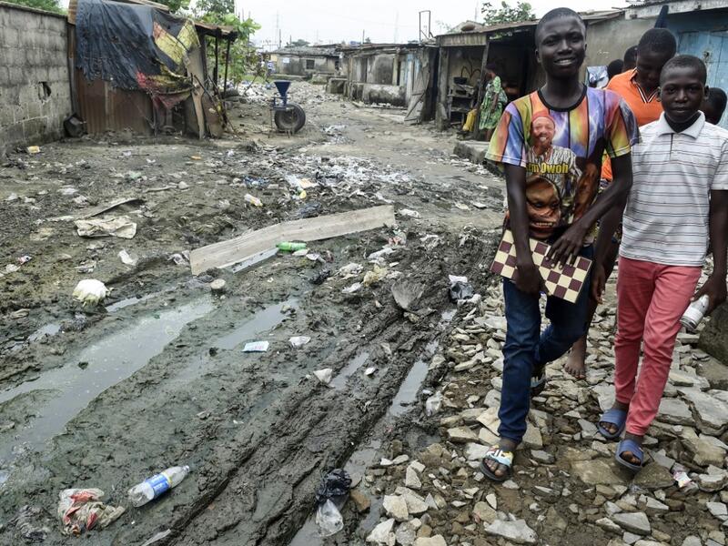 While dozens of matches are played simultaneously, participants, some as young as three years old, practice this brain game often considered out of reach for the poor populations of Africa's most populous country. PIUS UTOMI EKPEI / AFP