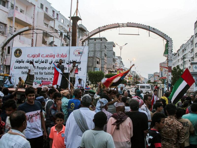 People fly the flags of the UAE (R) and south Yemen (L) as Yemenis from the country's south gather ahead of a demonstration in support of the UAE called for by the Southern Transitional Council (STC) which seeks independence for south Yemen, at al-Maala square in the centre of the second city of Aden on September 4, 2019. (AFP/ File Photo)