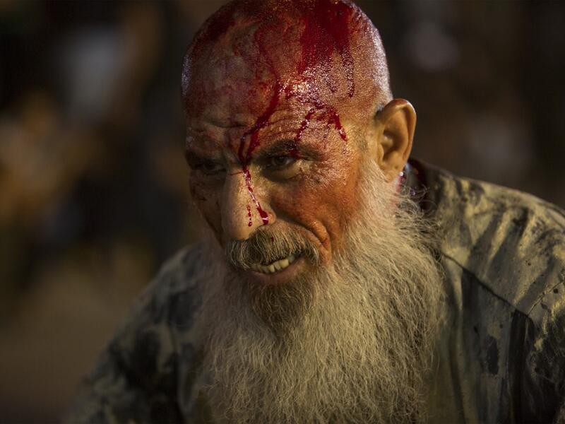 An Iraqi Shiite Muslim covered with blood takes part in commemorations marking the 8th day of Muharram ahead of Ashura , in the southern city of Basra. Hussein FALEH / AFP