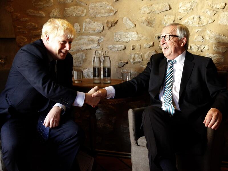 EU Commission president Jean-Claude Juncker (R) shakes hands with British Prime Minister Boris Johnson (L) prior to their meeting, on September 16, 2019 in Luxembourg. (AFP/ File Photo)