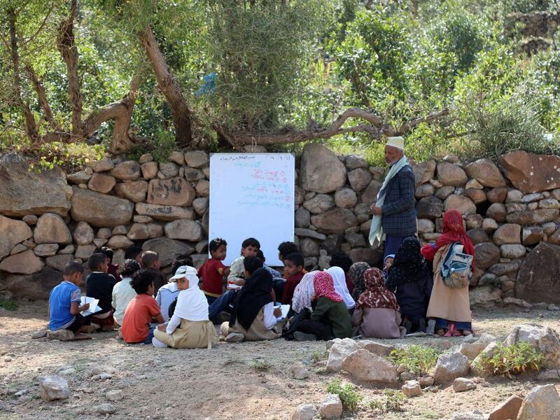The classes are given in a field outside the school which was under construction but was never completed when funding was stopped due to the war that broke out in Yemen in 2015. AHMAD AL-BASHA / AFP