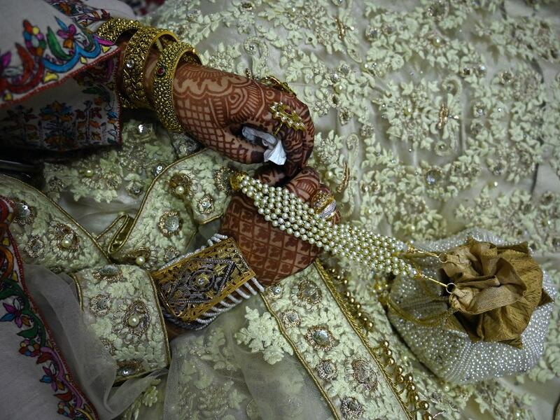 In this photo taken on September 15, 2019, a bride sits in her new husband's home following their marriage in Kashmir's Baramulla district, north of Srinagar. TAUSEEF MUSTAFA / AFP