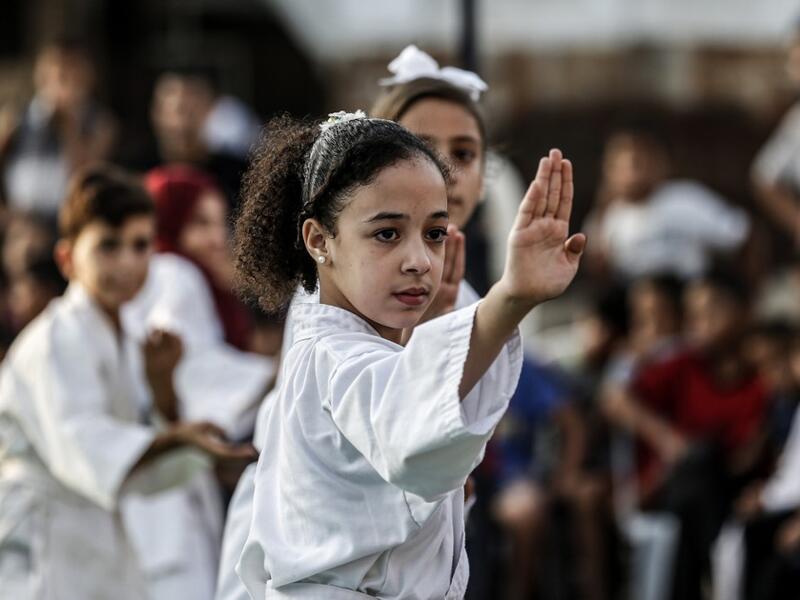 Young Palestinian karatekas demonstrate their skills during a Karate promotion ceremony at a sporting centre in the Rafah camp for Palestinian refugees in the southern Gaza Strip on September 20, 2019. SAID KHATIB / AFP