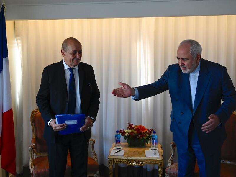 French Minister of Foreign Affairs Jean-Yves Le Drian (L) and Mohammad Zarif, Foreign Minister of Iran look on before their meeting on September 22, 2019 in New York City. (Johannes EISELE / AFP)