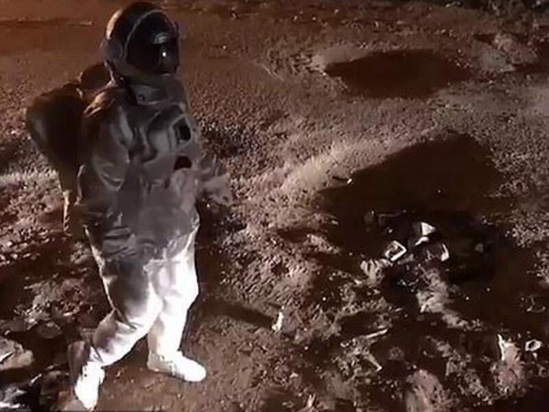 The man takes slow steps as he pretends to be on the moon which has gravity of around 17% compared to that on Earth  (Facebook)