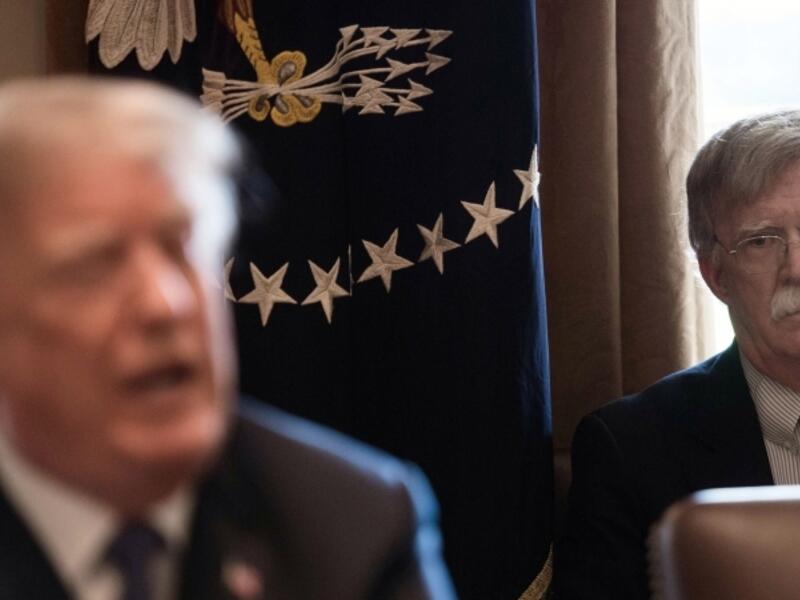 National Security Adviser John Bolton(R) listens to US President Donald Trump speak during a cabinet meeting at the White House in Washington, DC. (AFP/ File Photo)