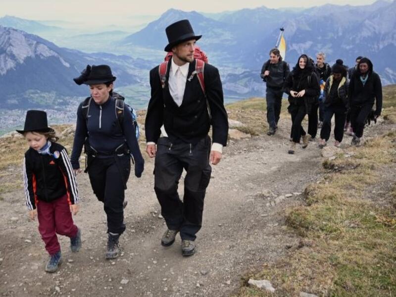 Dozens of people dressed in black went on a "funeral march" up a steep Swiss mountainside on Sunday to mark the disappearance of an Alpine glacier amid growing global alarm over climate change (Twitter)