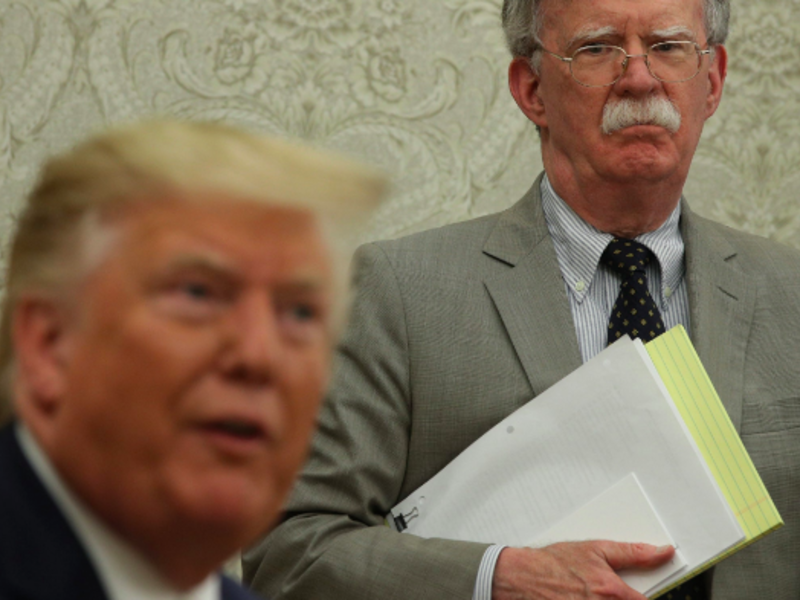 Trump (L), Bolton two faces of US foreign policy 