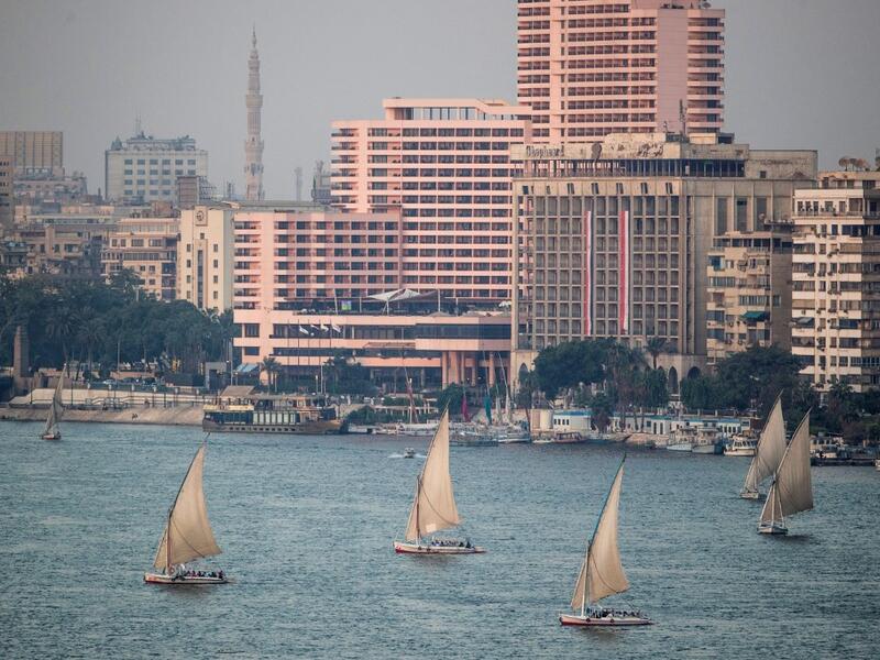 A picture taken on September 30, 2019 shows Egyptian sail boats, known as Feluccas, sailing down the Nile River off central Cairo. (Khaled DESOUKI / AFP)