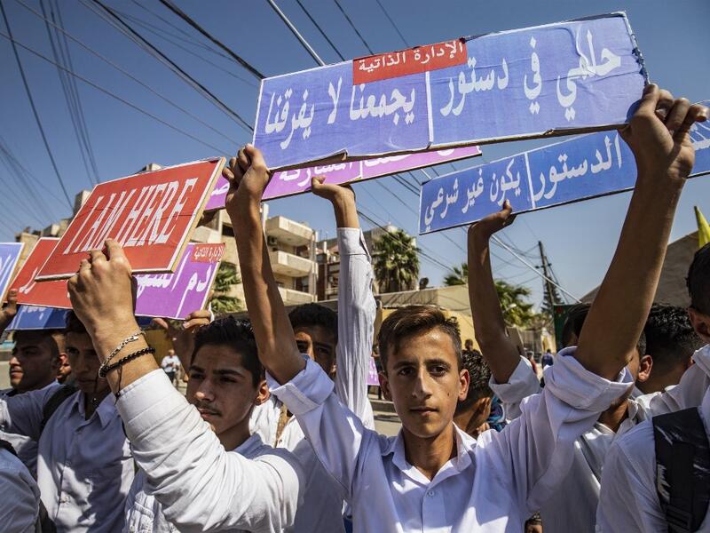 Syrian Kurds demonstrate in front of the United Nations offices in the Kurdish-majority city of Qamishli in northeast Syria on October 2, 2019 over their exclusion from the UN-backed constitutional committee. Delil SOULEIMAN / AFP