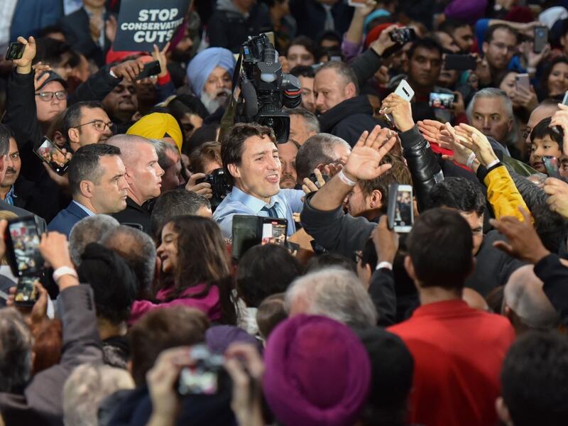 Leader of the Liberal Party of Canada, Prime Minister, Justin Trudeau, greets his supporters during a "Team Trudeau 2019" Rally at the Woodward’s Atrium in Vancouver B.C. on October 20, 2019. (Don MacKinnon / AFP)