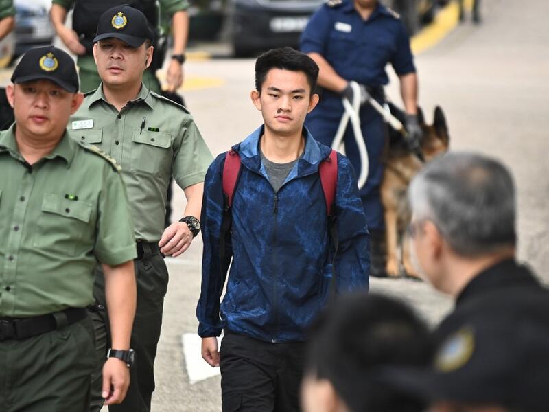 Chan Tong-kai, 20, wanted in Taiwan for the murder of his pregnant girlfriend during a holiday the two Hong Kongers took there in 2018, walks out the Pik Uk Prison in Hong Kong on October 23, 2019, after serving a short jail sentence for stealing his girlfriend's possessions. (AFP/ File Photo)