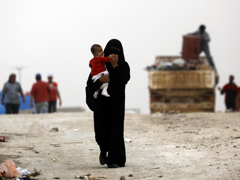 Displaced Syrians who fled the Islamic State's capital of Raqqa before it fell to Syrian forces are housed in Ain Issa, a camp north of the city. (Delil Souleiman/AFP via Getty Images)
