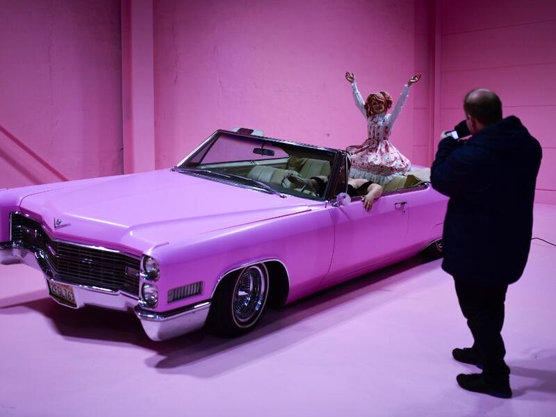 Instagram influencer "Anmaykaa" is being photographed at the "Supercandy Pop-Up Museum Vol. 2" in Cologne, western Germany on November 1, 2019. It is an interactive museum and offers a photo backdrop for social media at 25 stations. INA FASSBENDER / AFP