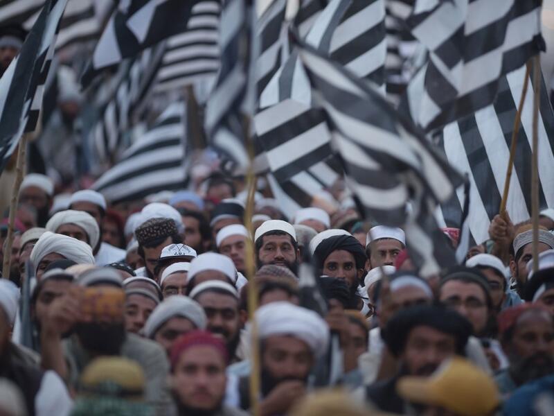 Activists of Islamic political party Jamiat Ulema-e-Islam (JUI) wave party flags during an anti-government "Azadi (Freedom) March" in Islamabad on November 2, 2019. Tens of thousands of Islamists rallied alongside opposition supporters in Pakistan's capital Friday, as the firebrand cleric leading the protests called on Prime Minister Imran Khan's government to step down within 48 hours. FAROOQ NAEEM / AFP