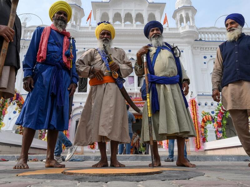 Sikh pilgrims gather as they take part in a ritual procession at a shrine in Nankana Sahib, some 75 kms west of Lahore on November 7, 2019, on the occasion of the 550th birth anniversary of Guru Nanak Dev. A corridor that will allow Sikhs to cross from India into Pakistan to visit one of the religion's holiest sites is set to open on November 9, with thousands expected to make a pilgrimage interrupted by decades of conflict. Arif ALI / AFP
