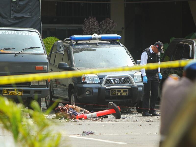 Indonesian police examine a body of a suspected suicide bomber at their headquarters in Medan, North Sumatra, on November 13, 2019, after a suicide attack occured during their morning roll call. (AFP/ File Photo)