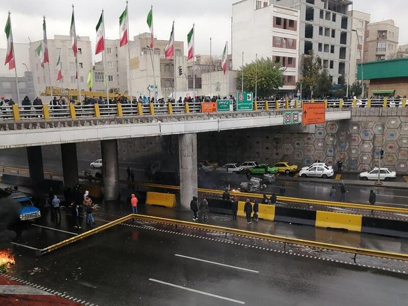 Iranian protesters block a road during a demonstration against an increase in gasoline prices in the capital Tehran, on November 16, 2019.  (AFP/ File Photo)