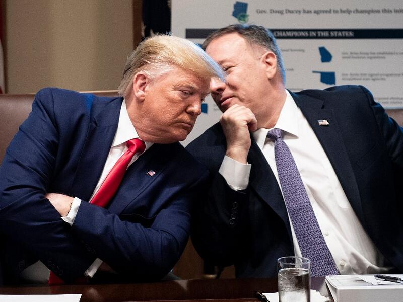 US President Donald Trump (L) listens to US Secretary of State Mike Pompeo during a Cabinet Meeting at the White House in Washington,DC. (AFP/ File Photo)