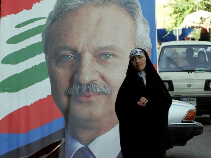 Former Lebanese finance minister Mohammed Safadi, pictured in poster, decided to withdraw following consultations with political parties. (AFP file)