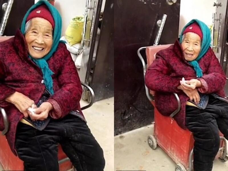 It was captured after 106-year-old Mrs Wuyang had come back from a wedding ceremony, bringing with her a handful of nuptial candy, according to Yang Gengsheng, a neighbour who recorded the clip. (Video screenshot)