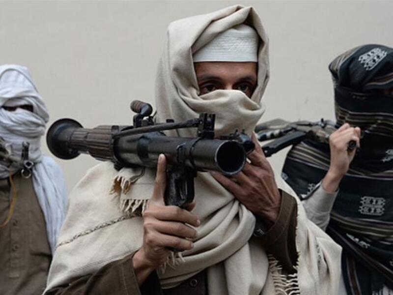 Former Afghan Taliban fighters hand over their weapons as part of a government reconciliation process in Nangarhar province. (AFP)