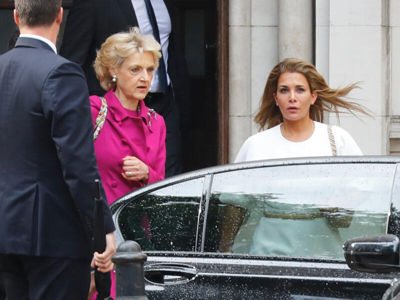 Princess Haya bint al-Hussein of Jordan (right), accompanied by her lawyer lawyer Fiona Shackleton (center), leaves the High Court in London on Tuesday. (Tolga Akmen/AFP/Getty Images)