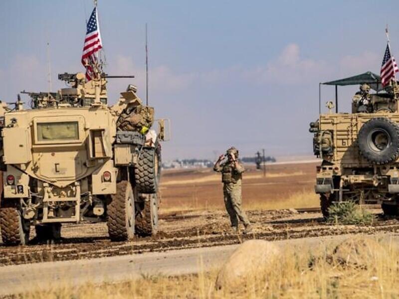 A convoy of US military vehicles drives through the Syrian northeastern town of Qahtaniyah on the border with Turkey on October 31, 2019 (Delil SOULEIMAN / AFP)
