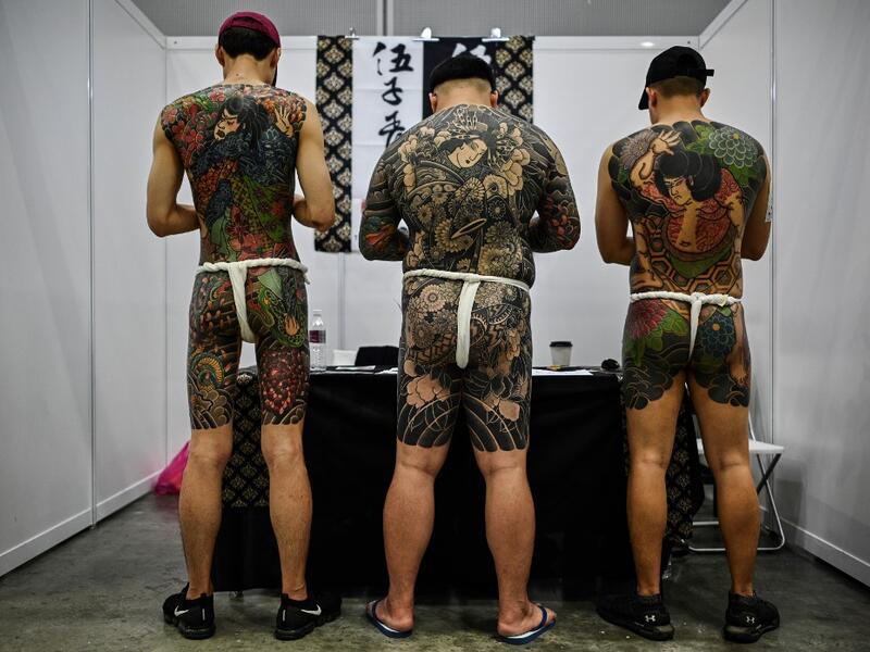 Malaysian officials slammed a tattoo exhibition held in the country as "porn" unsuitable for a Muslim-majority country, after images of half-naked men and women went viral (AFP)
