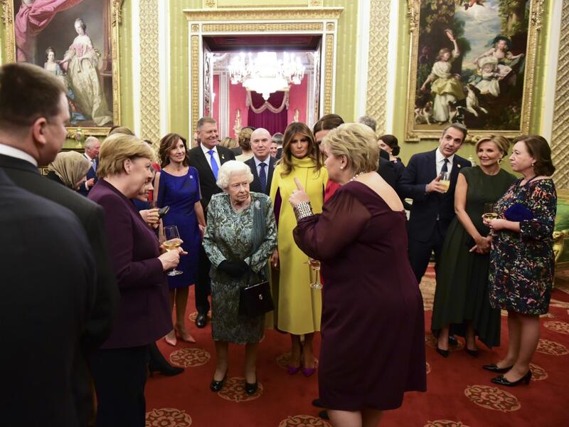 Britain's Queen Elizabeth II (C) talks with guests in Buckingham Palace in central London on December 3, 2019, during a reception hosted by Britain's Queen Elizabeth II ahead of the NATO alliance summit. NATO leaders gather Tuesday for a summit to mark the alliance's 70th anniversary but with leaders feuding and name-calling over money and strategy, the mood is far from festive. Geoff Pugh / POOL / AFP