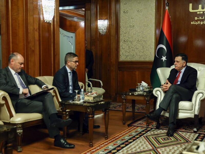 Libya's UN-recognised Prime Minister Fayez al-Sarraj (R) meets with the European Union's ambassador to Tripoli Alan Bugeja (L) and Germany's ambassador Oliver Owcza in the Libyan capital on December 5, 2019. (AFP/ File Photo)