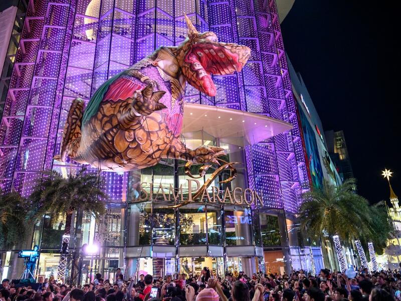 A giant balloon representing a mythical creature flies over the crowd during 'The Quest of Adventure in the World of Magical Tales' Christmas show performed by French group Plasticiens Volants in Bangkok on December 8, 2019. Mladen ANTONOV / AFP