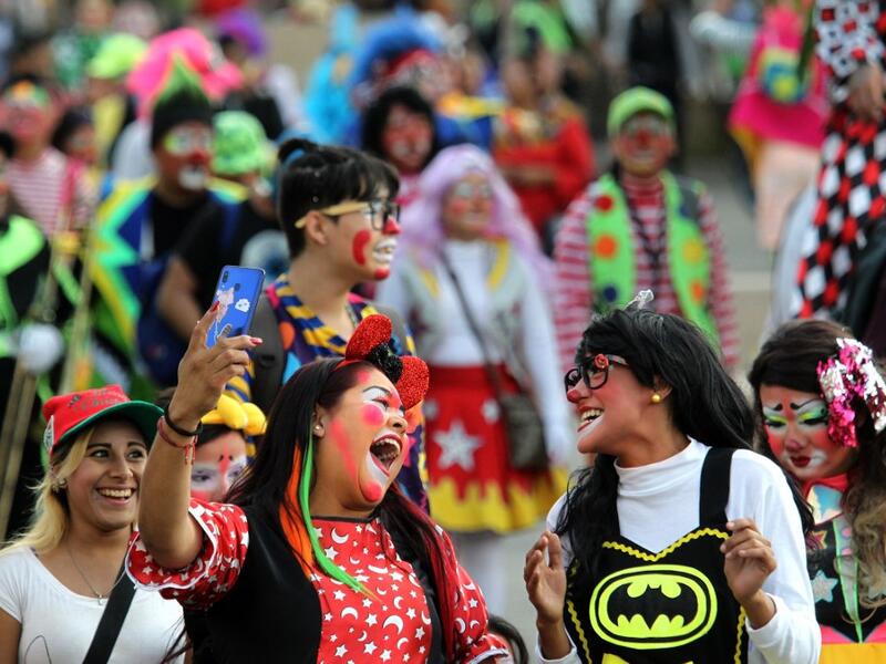 A group of clowns play during the International Clown Day in Guadalajara, Mexico, on December 10, 2019. Ulises Ruiz / AFP