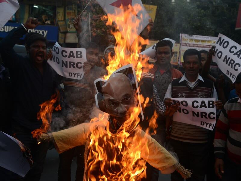 Protests against a divisive new citizenship law raged on December 14 as Washington and London issued travel warnings for northeast India following days of violent clashes that have killed two people so far. DIPTENDU DUTTA / AFP